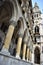 Glimpse of arcades, with columns in the foreground and above the tower of the historic and beautiful palace, seat of the Vienna Ci