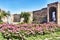 Glimpse of the courtyard wirh rose garden and ruins of a Roman Empire Domus: Fortuna Annonaria