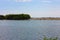 Glimpse of sea and river among the nature of marina di pisa in the tuscan serenity of the summer landscape