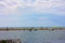 Glimpse of sea and river among the nature of marina di pisa in the tuscan serenity of the summer landscape