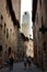 Glimpses of the romantic Tuscan town of San Gimignano in stones on the ancient hill