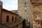 Glimpses of the romantic Tuscan town of San Gimignano in stones on the ancient hill