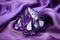 a glistening amethyst cluster on a satin cloth