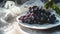 Glistening Black Grapes: A Sunlit Delight on a White Plate- Captured in Stunning