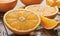 Glistening Citrus Slices: Juicy Oranges Adorn the Table with Dewy Elegance