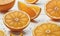 Glistening Citrus Slices: Juicy Oranges Adorn the Table with Dewy Elegance