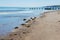 glistening sea, beach and wooden barrier at Spittal, Northumberland