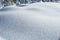 Glistening sunlight on crystalized snow covered field