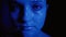 Glitter art makeup woman shimmering face blue glow