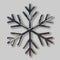 Glitter covered black snowflake. Realistic 3d illustration of shimmering metallic snowflake isolated on gray background. Greeting