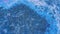 Glitter fluid spill paint drip blue black ink mix