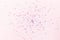 Glitter flying sparkles on pink pastel trendy background. Festive backdrop for graphic design projects