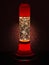 Glitter lava lamp with light behind. Genuine vintage 1970 edition, red orange colour.