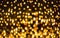 Glitter lights background. Holiday bokeh texture. Dark gold and black