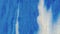 Glitter paint spill fluid background blue white