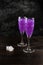 Glitter purple drink in a glass of champagne