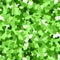 Glitter seamless texture. Actual green particles. Endless pattern made of sparkling hearts. Mind-blo