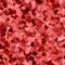 Glitter seamless texture. Actual red particles. Endless pattern made of sparkling hearts. Stunning a