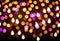 glitter vintage lights background. gold, purple and black. de-focused