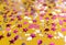 Glittering confetti on yellow background