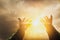Glittering light and shines through hands of man who raise their hands to pray for God`s blessings,mind sanctification concepts
