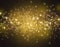 Glittering stars on a gold bokeh background. Night sky with stars background / texture