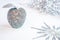 Glittery silver apple and a snowflake on a white background.