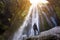 Gljufrabui waterfall in South Iceland,  adventurous traveller standing in front of the stream cascading into the gorge or canyon,