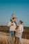 Global Day of Parents. Happy family enjoying together on a sunny day in country. father, mother and two boy children having fun