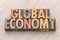 Global economy word abstract in wood type