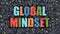 Global Mindset on Dark Brick Wall.
