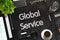 Global Service - Text on Black Chalkboard. 3D Rendering.