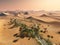 Global temperature change concept. Lonely sand ridges under striking evening sunset sky at drought desert landscape 3d