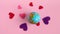 Global Valentines Day Concept - Spinning Earth with Hearts, isolated on beige pastel background. Love the Earth Planet