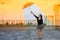 Global warming woman holding an umbrella is in a comfortable climate