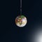 Globe is hanging by a thread on dark background. Our planet rescue concept. Earth in the balance. World is in danger