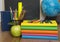 Globe, notebook stack and pencils. Schoolchild and student studies accessories.