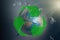 Globe of planet Earth in a garbage bag. Green recycling sign. The concept of conservation of the environment and its resources,