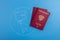 Globe and Russian passport, close-up