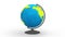 Globe on white desktop - transparent model of blue planet earth with green world map rotating around axis