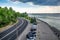 Gloomy cityscape of Sicheslavska Naberezhna streets and embankment of the Dnieper river in Dnipro Ukraine on a cloudy summer day