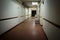 The gloomy corridor of the municipal budget hospital. Dark room, outdated architecture