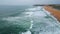 Gloomy day marine horizon drone view. Serene sea coast with calm grey waves surf