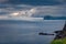 Gloomy evening view from Vagar island plateau, Gasadalur village location.