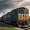 On a gloomy gray day in early spring, a freight train parked on siding near a gr...