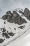 Gloomy mountain landscape with snow and sky