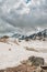 Gloomy mountain landscape with snow and sky