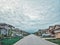 Gloomy weather with dramatic sky clouds in Alliston town, Ontario, Canada. Landscape scene with residential area road  street and