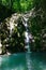 Glorious refreshing waterfall among rocks in a mountain forest