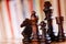 Glossy Black Wooden Chess Pieces on Board